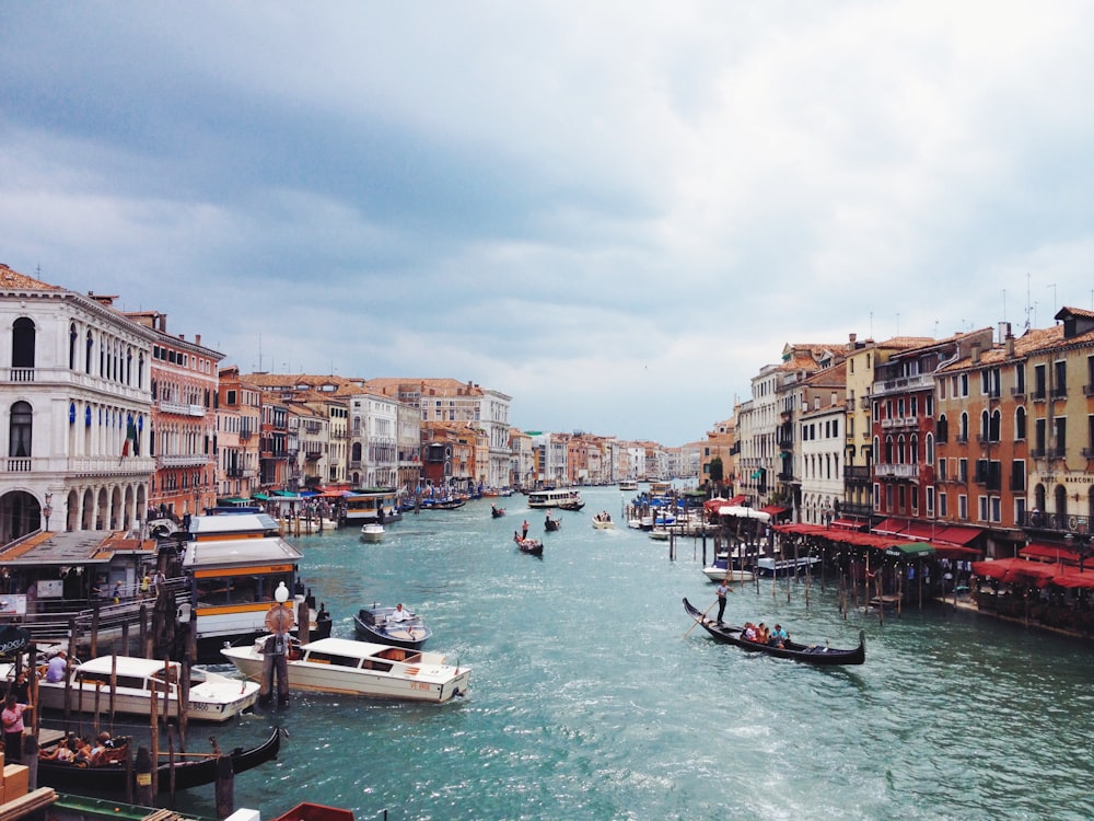 boats on body of water near buildings