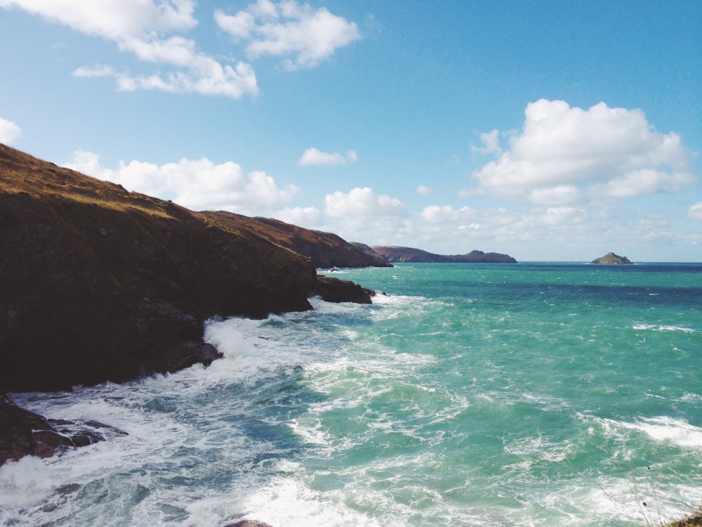 ocean near mountain