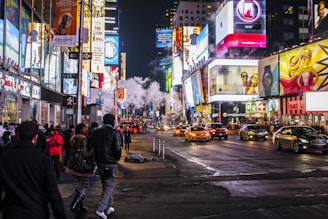 people walking beside buildings