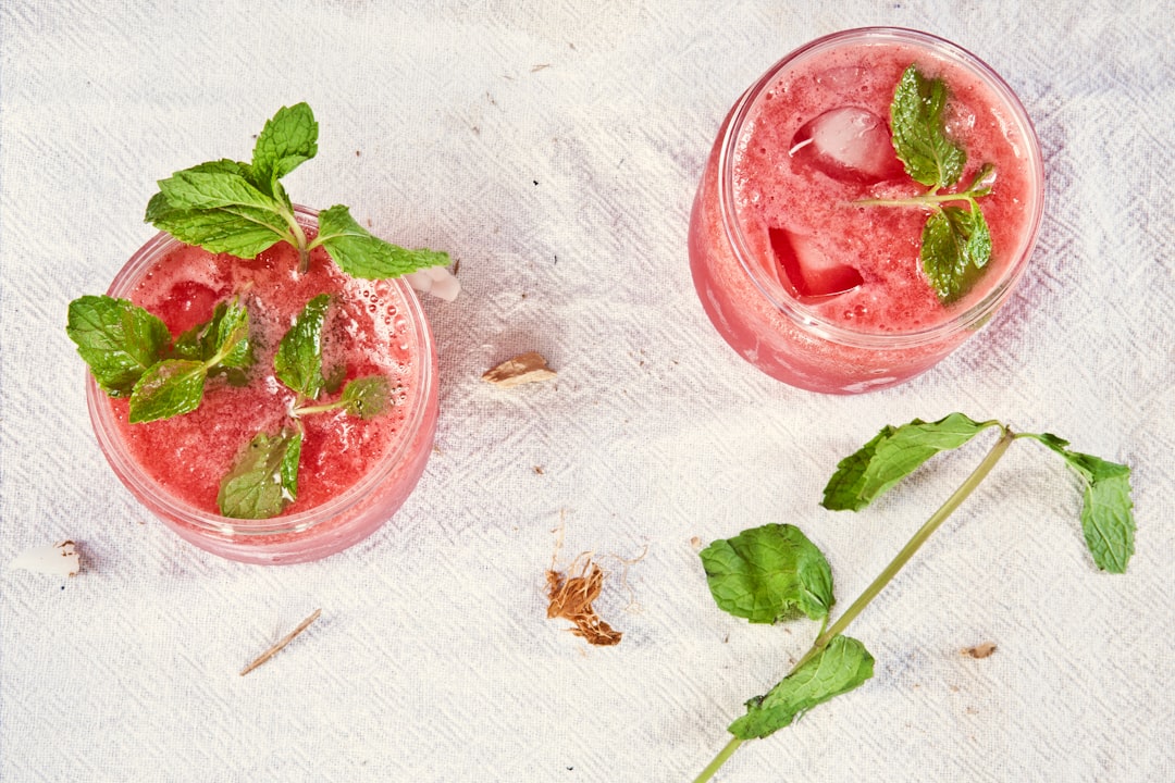 two filled clear drinking glasses, Strawberry Mojito