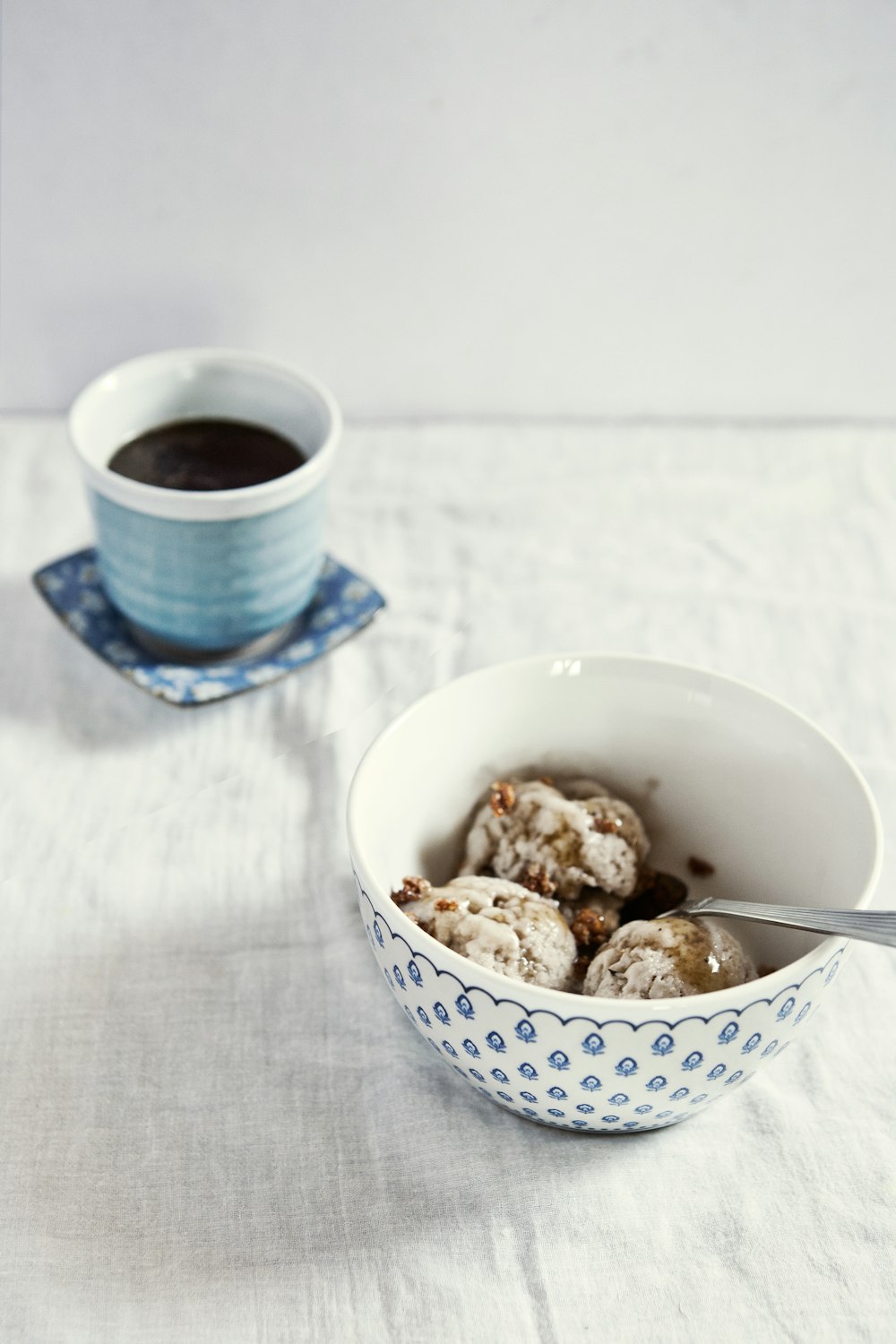 baked pastries in white and blue ceramic bowl