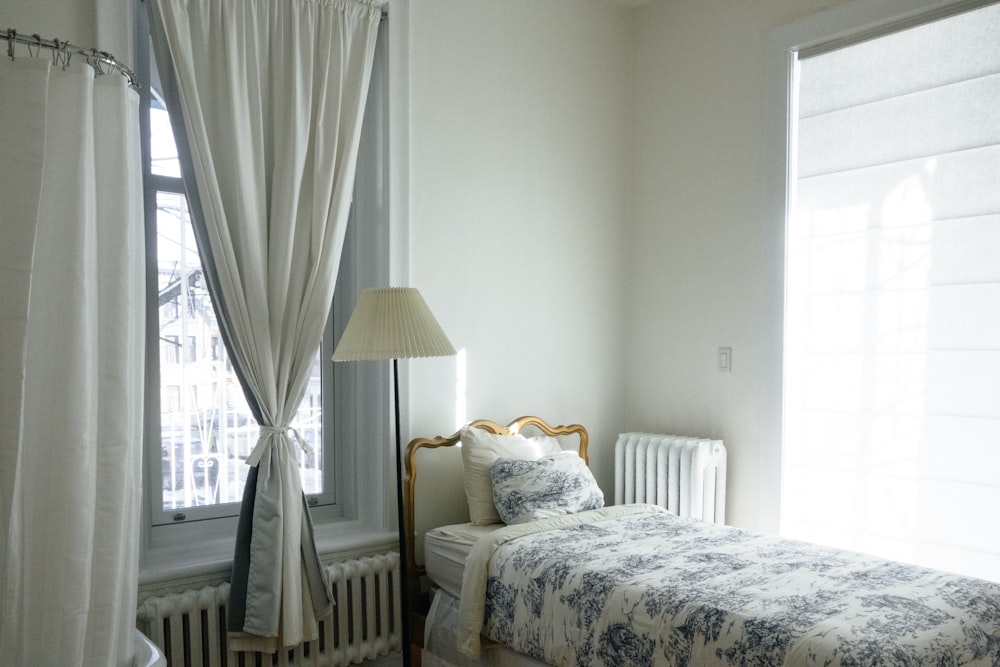 white and blue floral comforter