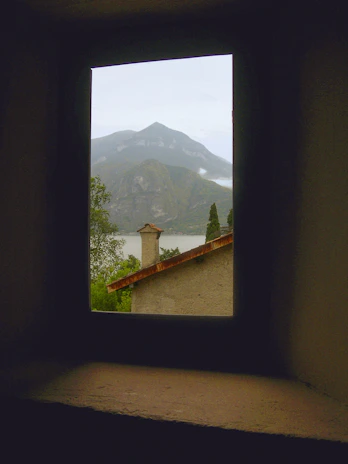 A serene mountain view outside a Pinnacle Trust office window, symbolizing stability and trust.