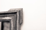 Close-up of a rustic wooden picture frame holding a family photo.