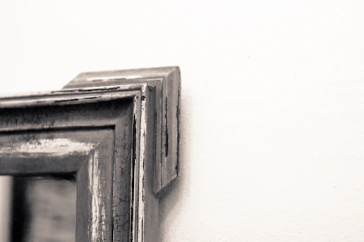Close-up of a high-quality photographic print displayed on a rustic wooden wall.