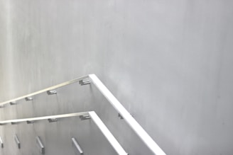 Industrial-style staircase with metal treads and minimalist railings.