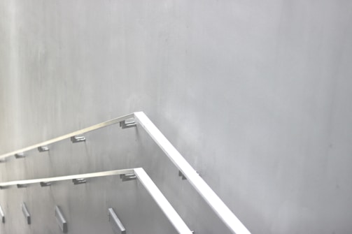 Industrial-style staircase with metal treads and minimalist railings.