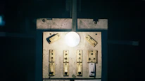 A glowing light switch being flipped on, representing the start of transformation.