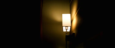Soft glowing lamp casting a gentle light over a peaceful corner of the therapy room.