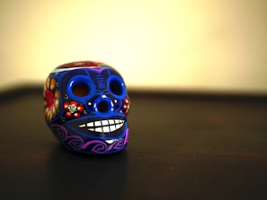 A colorful resin ashtray shaped like a skull.