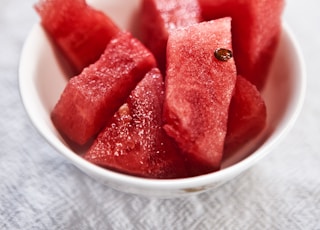 shallow focus photography of bowl of watermelon