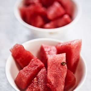 shallow focus photography of bowl of watermelon