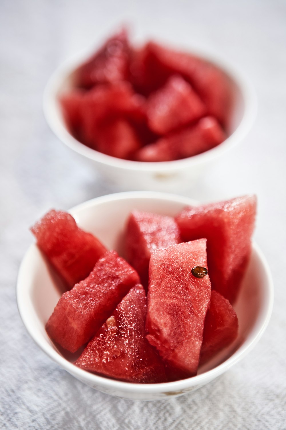 shallow focus photography of bowl of watermelon