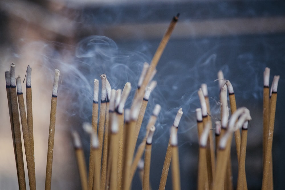 brown wooden sticks with white smoke