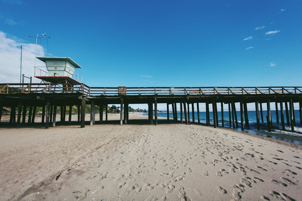 brown wooden dock under blue sky