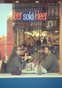 Iconic scene of Vincent and Jules sharing a conversation in a diner from Pulp Fiction.