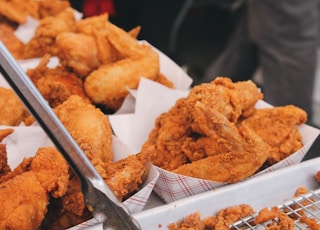 fried chicken on brown paper bag