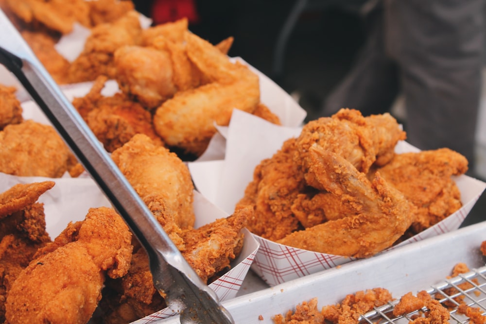 fried chicken on brown paper bag