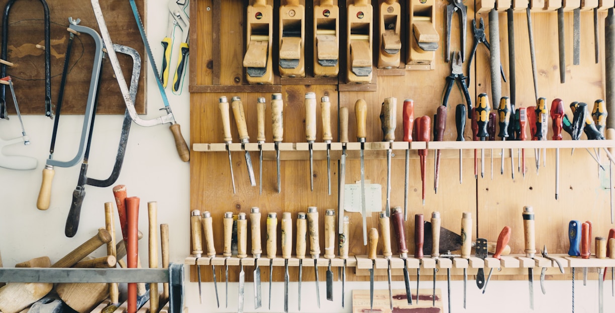 assorted handheld tools in tool rack