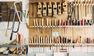 assorted handheld tools in tool rack