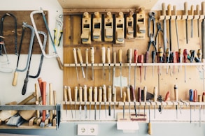 assorted handheld tools in tool rack