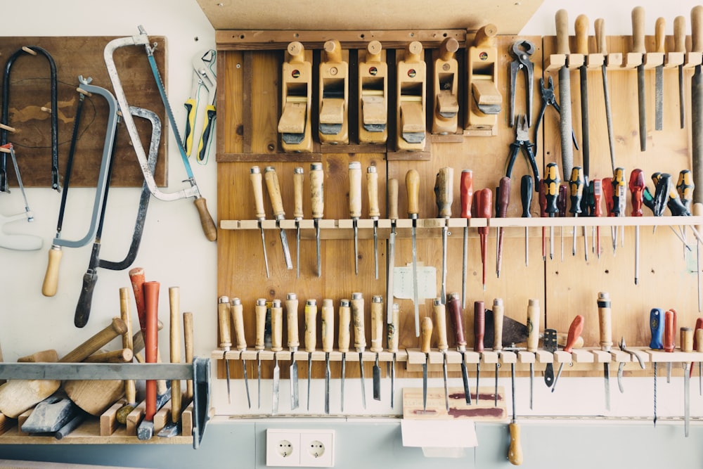 assorted handheld tools in tool rack