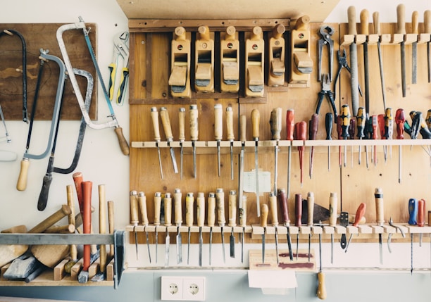 assorted handheld tools in tool rack