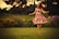 A model twirling in a vibrant, long dress in a sunlit outdoor garden.