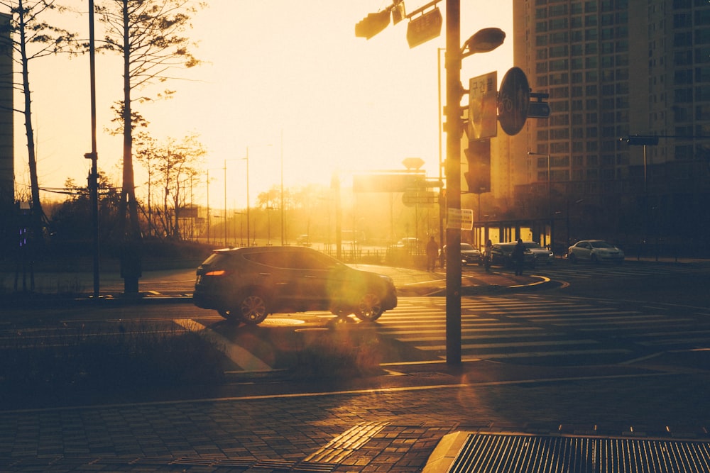 silhouette of car next of pedestrian lane