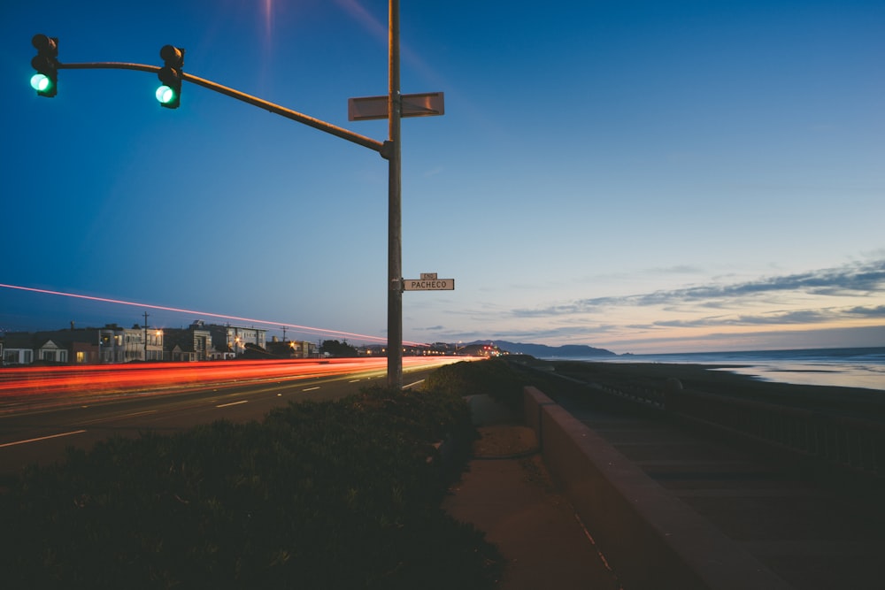 traffic light turned into green near baywalk during daytime