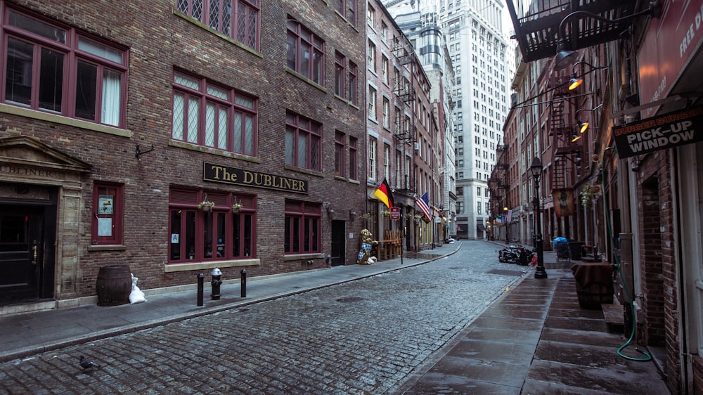 brown concrete building with alley