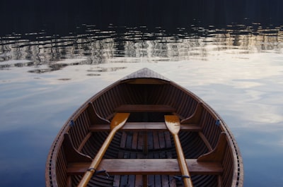 photo of oval brown rowboat canoe zoom background