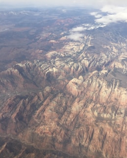 Aerial view of Mystic Mountain Ranch showing diverse terrain and forest patches.