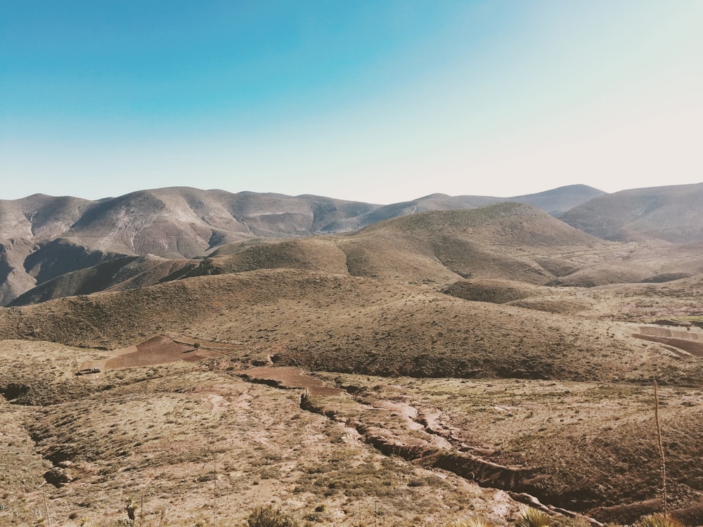 high-angle photography of mountains with green leafed trees during daytime