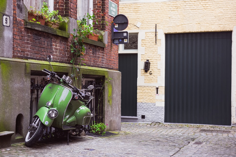 green motor scooter on a street