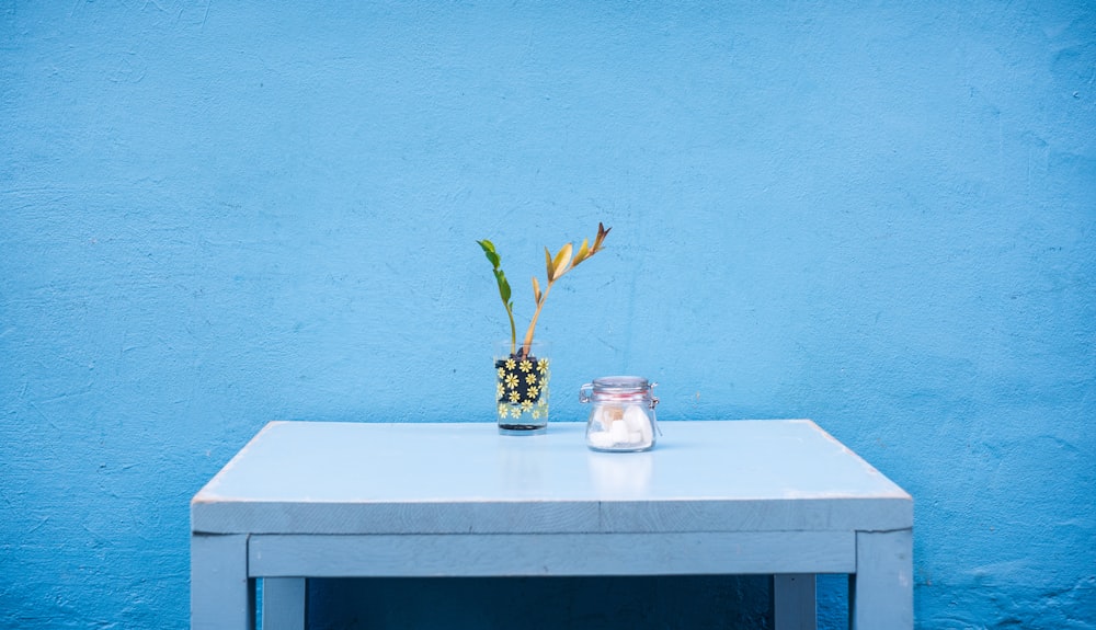 clear glass jar on gray wooden table