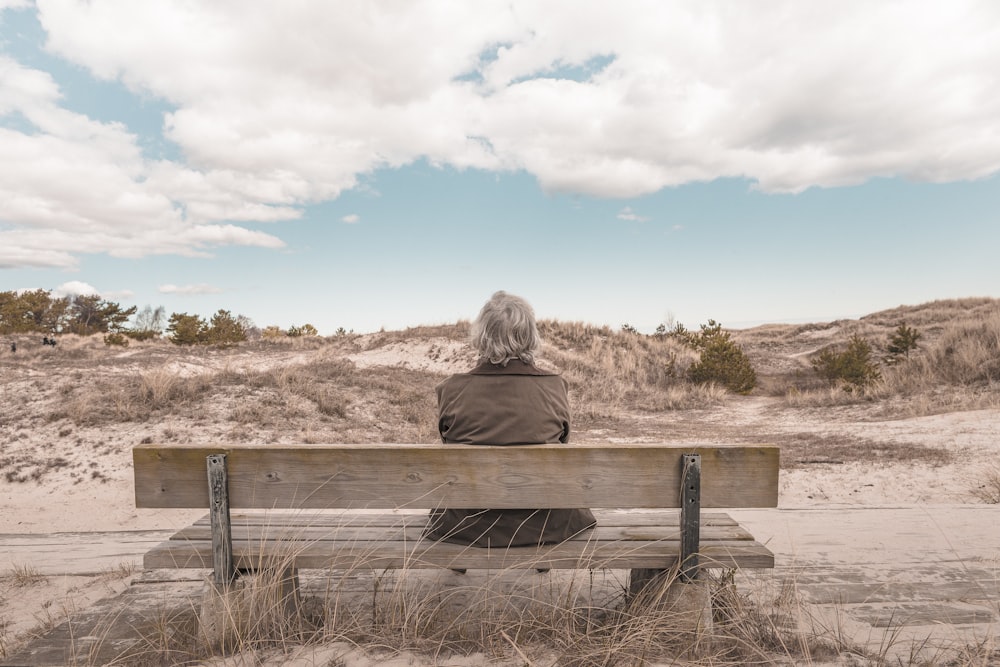 person sitting on bench