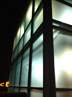 Exterior view of the Clínica Lumina building in Águas Claras at sunset.