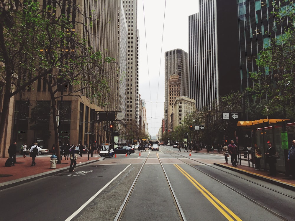 people walking on city sidewalk