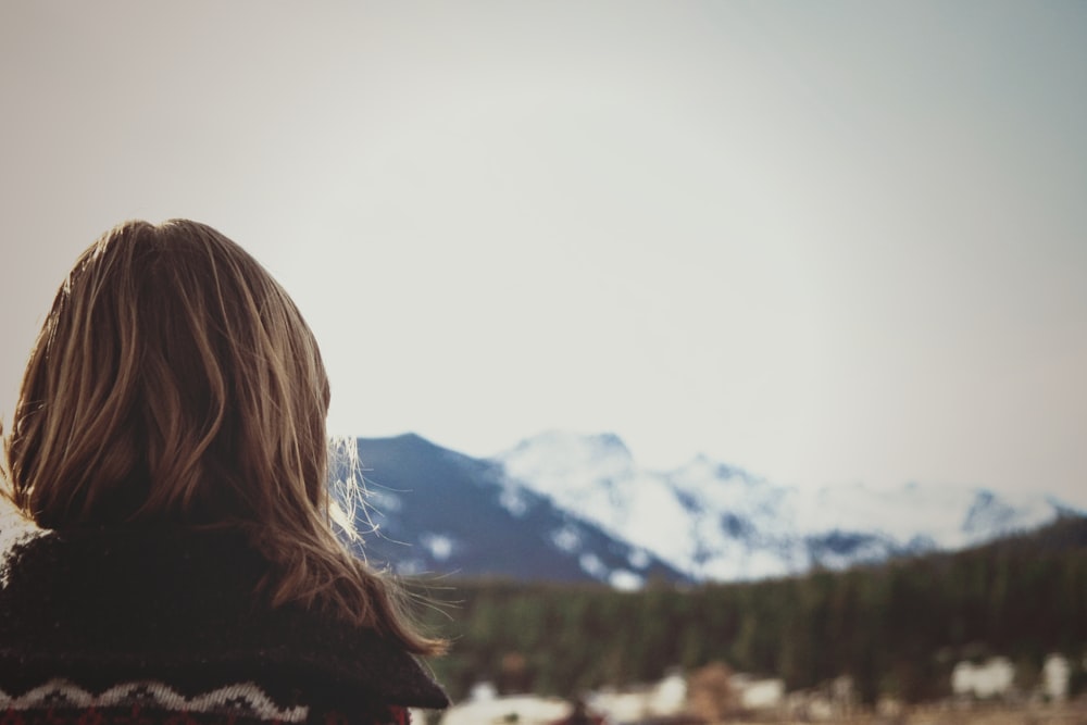 woman facing the mountain