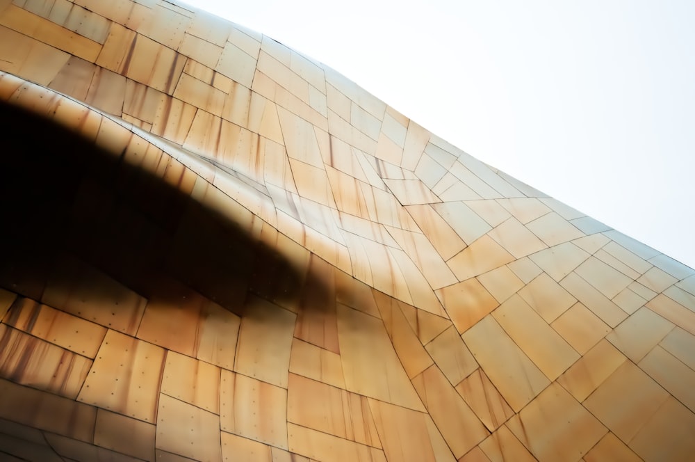 low angle photography of brown and white building