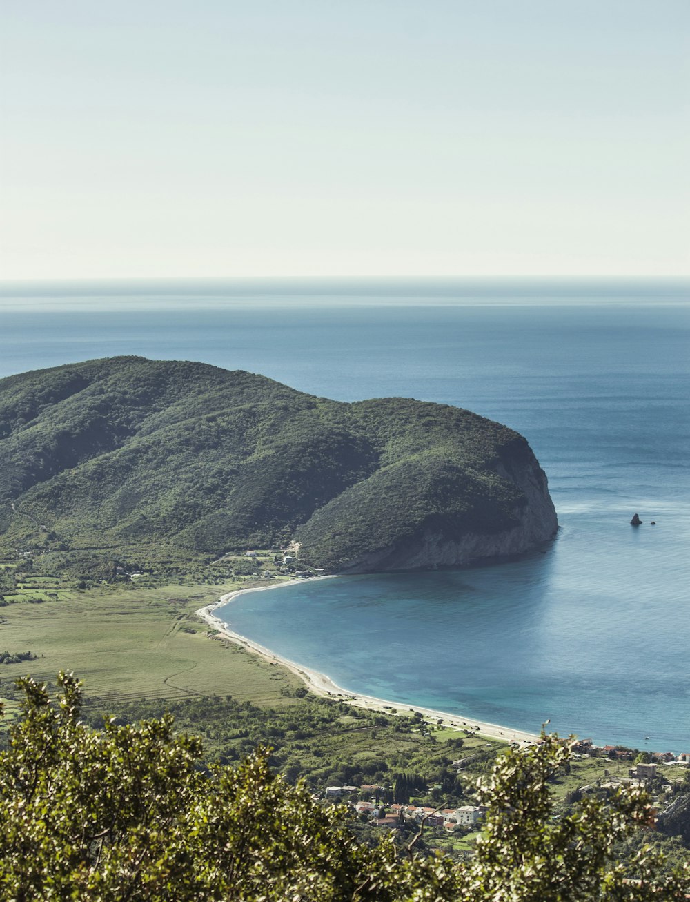 mountain near body of water during daytime