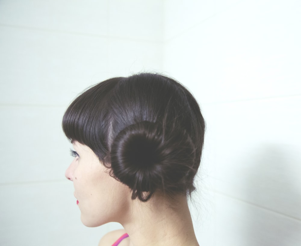 woman with straight black hair bun