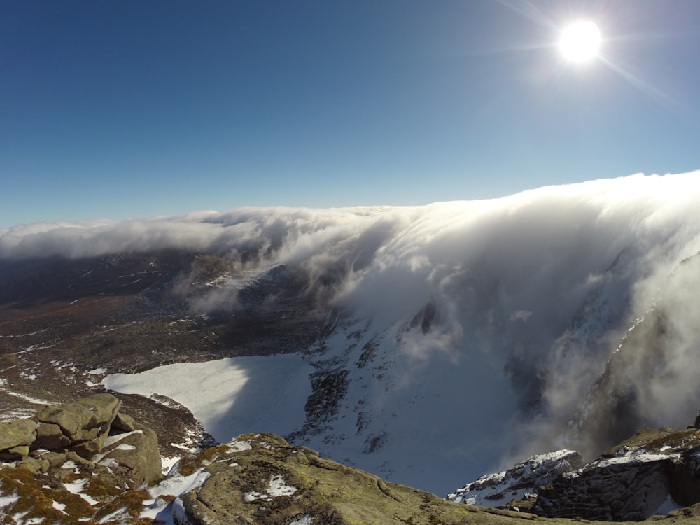 snowy mountain covered with clouds