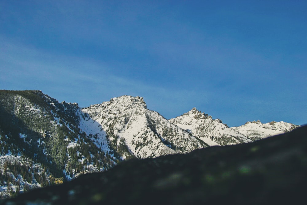 snow-covered mountaine under blue sky