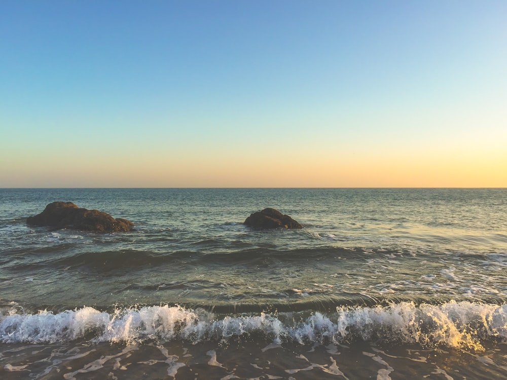 photo of waves crushing on seashore