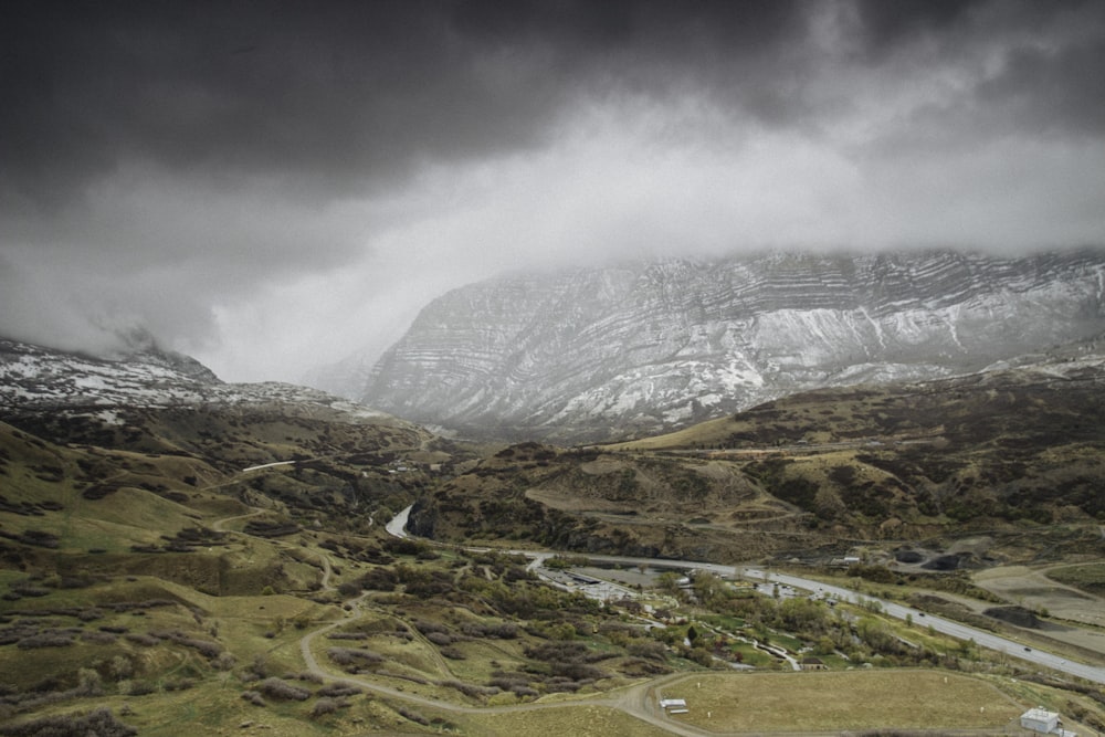 landscape photography of snow-covered mountain under cloudy sky during daytime