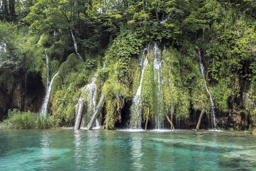 segmented waterfalls at daytime, lagoon-spring