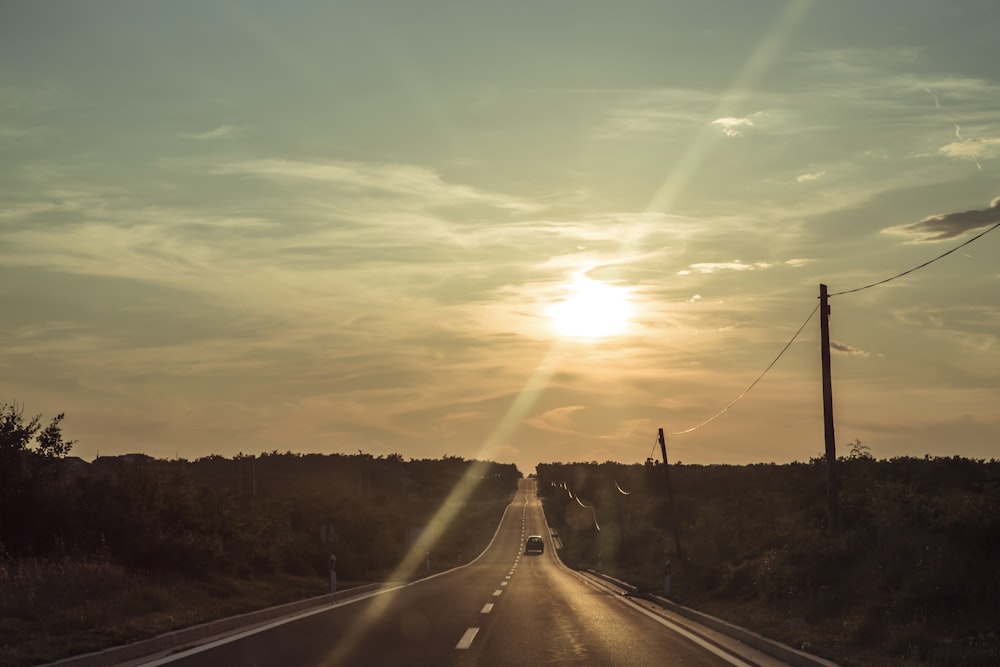 black asphalt road during sunset