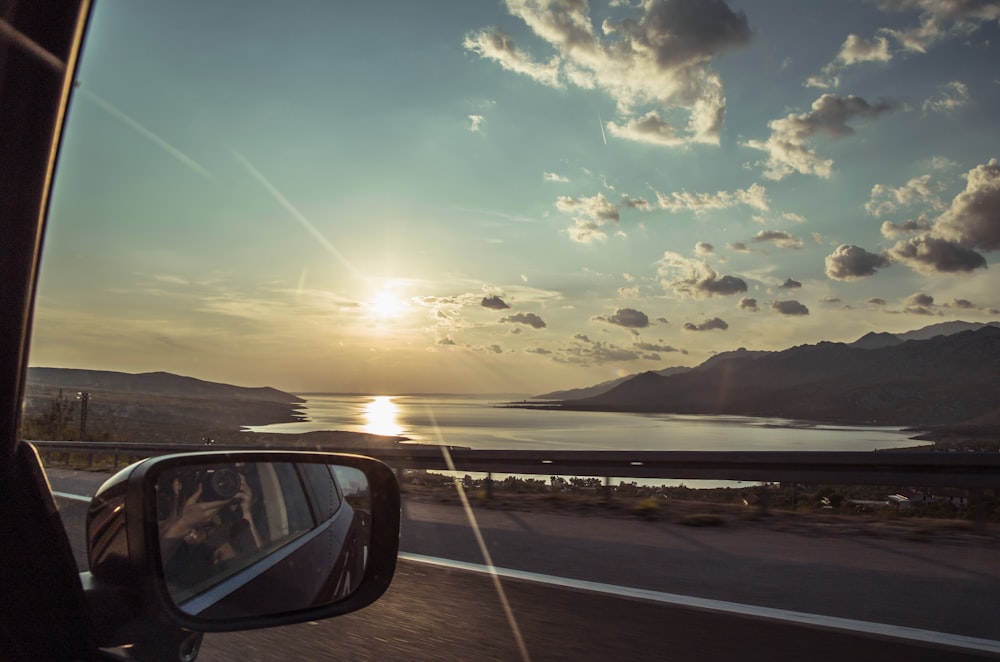 car on road during sunset